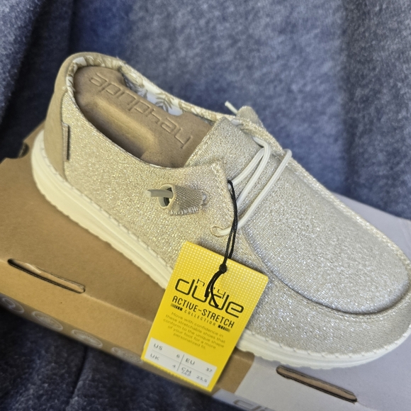 Ladies Hey Dude shoes. Gold shimmer color. - Picture 2 of 6